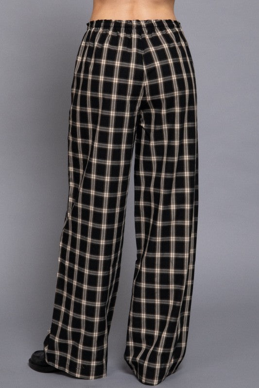 Black tartan plaid wide-leg pants with an elastic waistband, back view.
