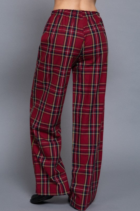 Red tartan plaid wide-leg pants with an elastic waistband, back view.