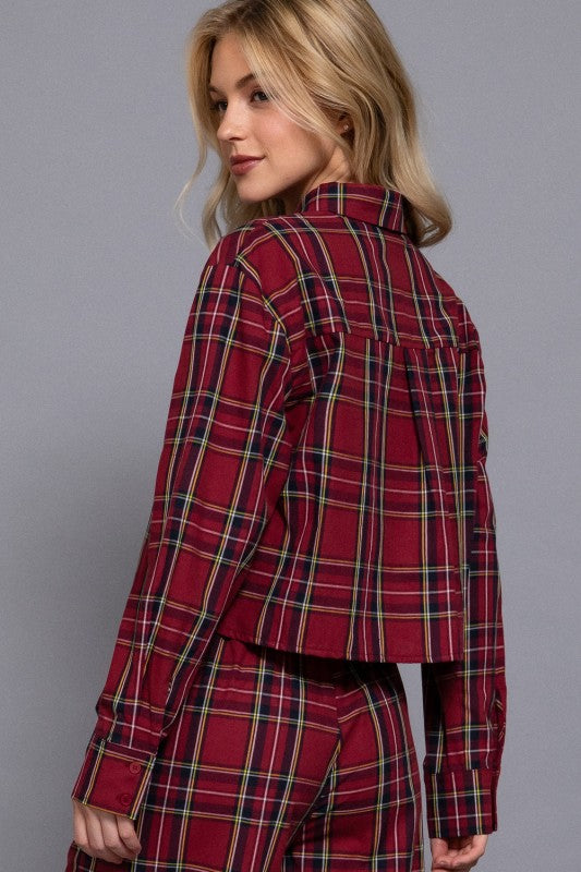 Red tartan plaid cropped shirt showing the back yoke and pleat.
