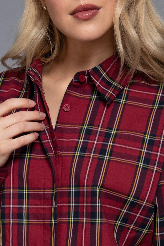 Red tartan plaid shirt close-up showing the collar and button front.