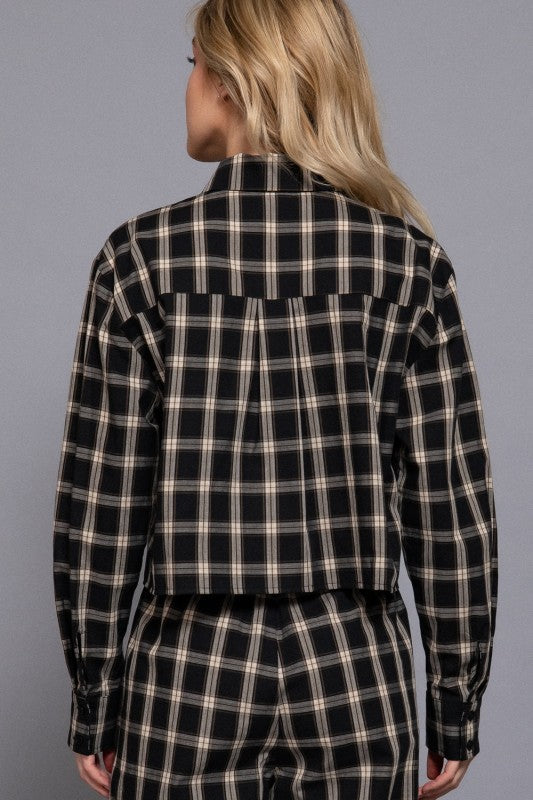 Black tartan plaid cropped shirt showing the back yoke and pleat.