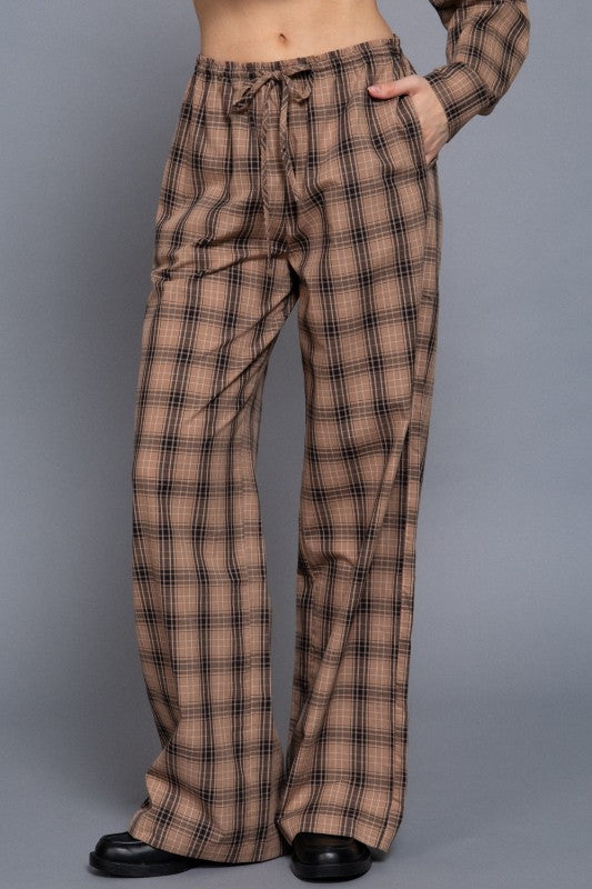 Beige tartan plaid wide-leg pants showing the drawstring waist and side pocket, front view.